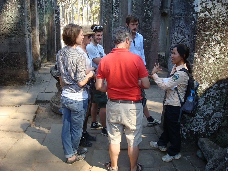 Group being guided through Angkor Wat