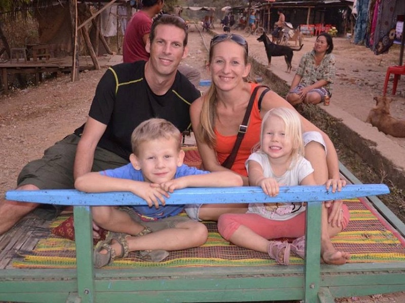family riding on the bamboo train