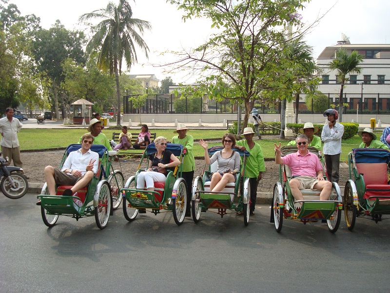 Group enjoying a cyclo tour of Phnom Penh