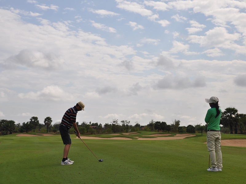 Golfer at the Grand Phnom Penh golf course