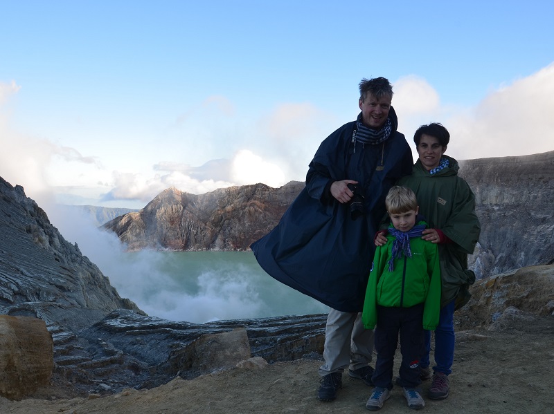 Family standing atop Mount Ijen