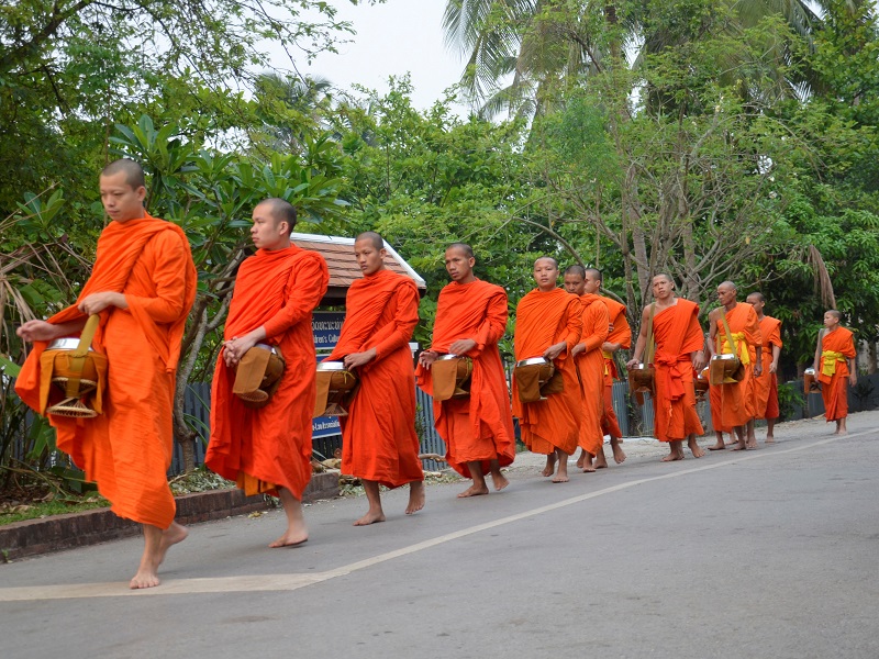 Monks collecting alms