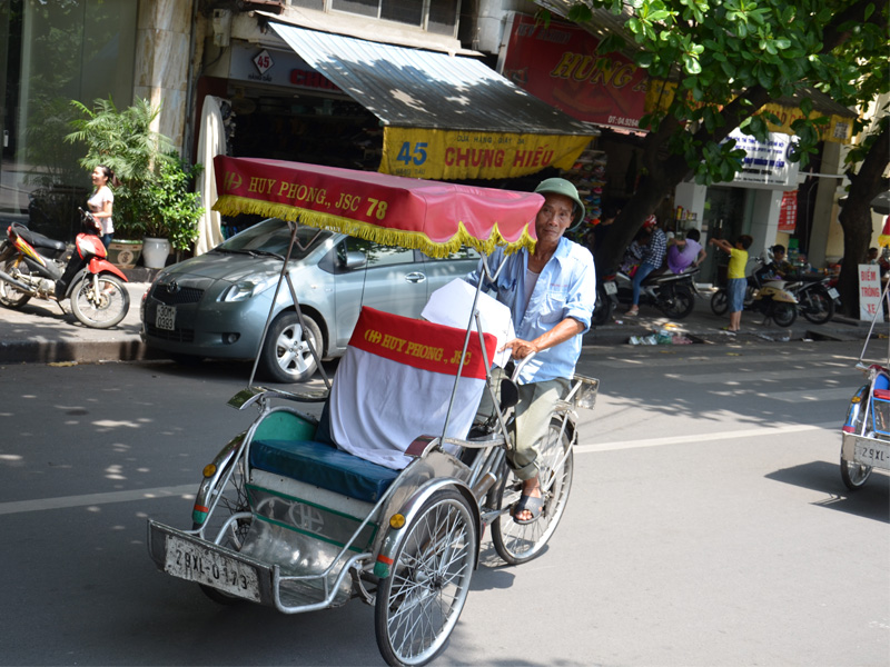 go on a cyclo tour of Hanoi