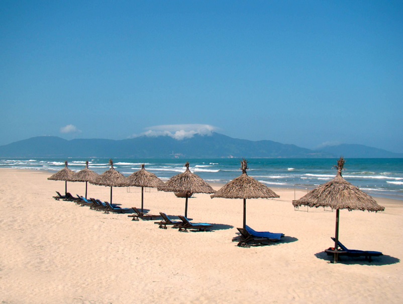 Beach umbrellas lined up on Da Nang Beach