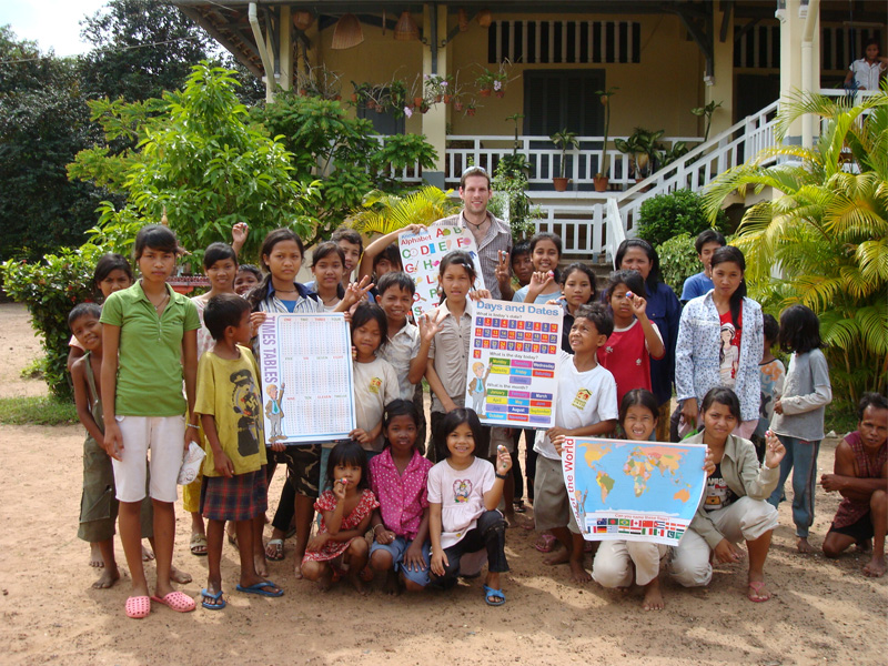 See Asia Differently founder Peter Jones posing with students of a local community