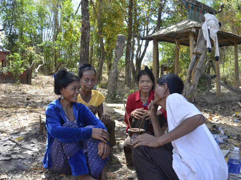 Four villagers of the Treak village talking together