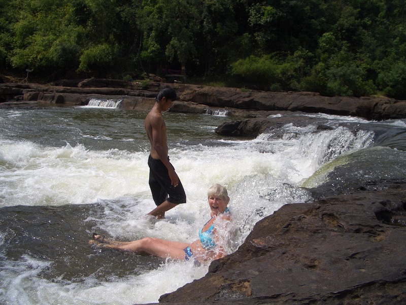Jane swimming in waterfall