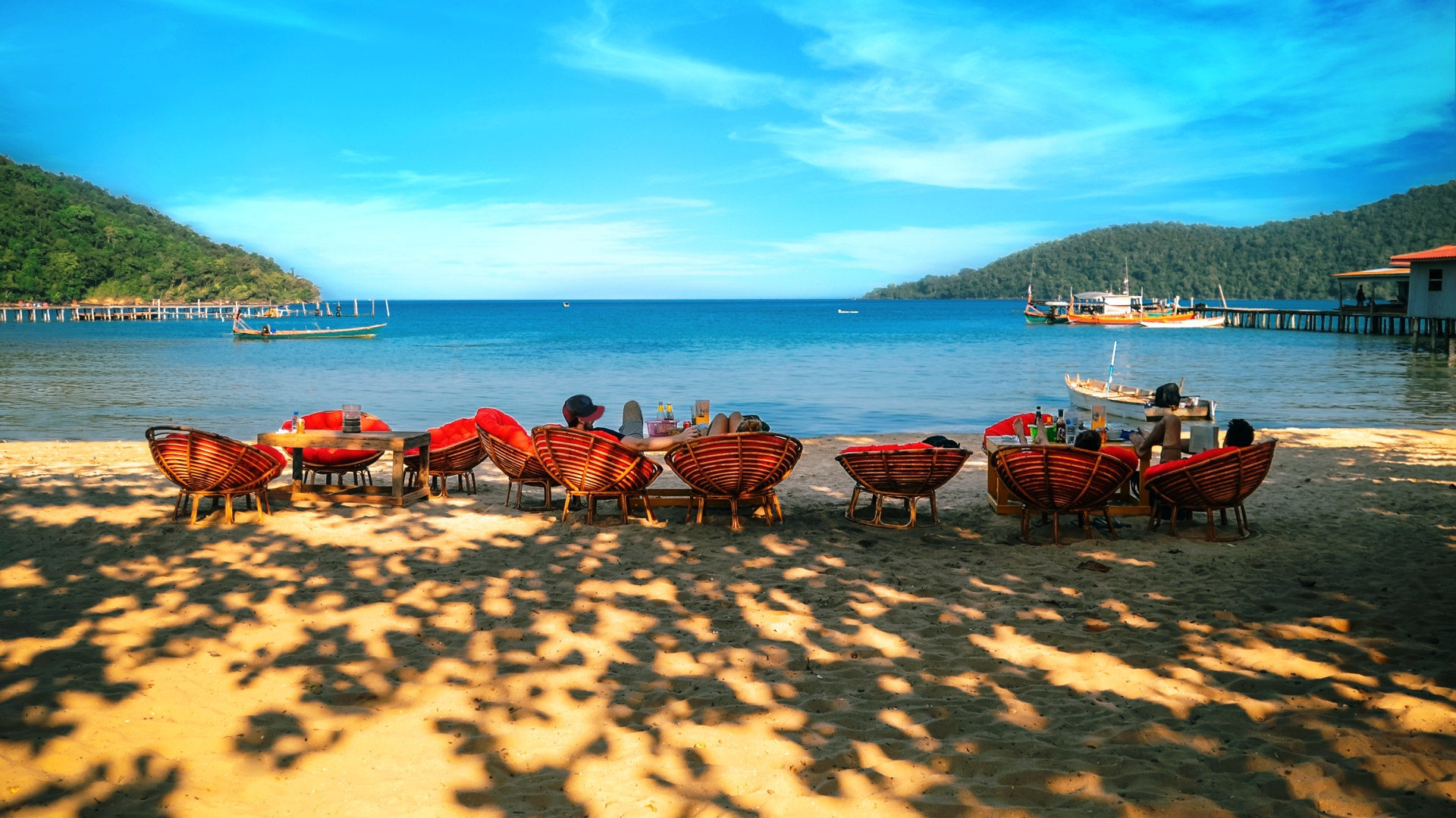 group of people lounging on beach