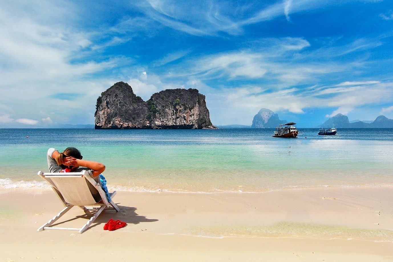 Man lounging on a beach in Thailand